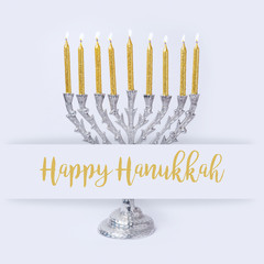 Jewish holiday Hanukkah greeting design with menorah on white background