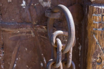 Close up shot of an old ottoman door. Old rusty gate latch on the door