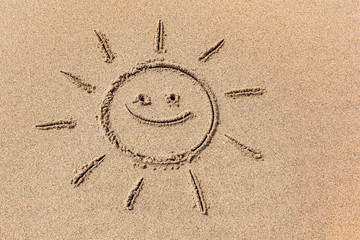 Drawing of the sun on the sand