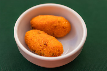 Arancini / Supli (deep fried rice balls with meat or vegetables and cheese mozzarella) Typical Sicilian street food. Italy