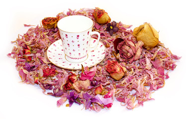 tea pair of fine porcelain among scattered petals of hydrangea and rose flowers  background