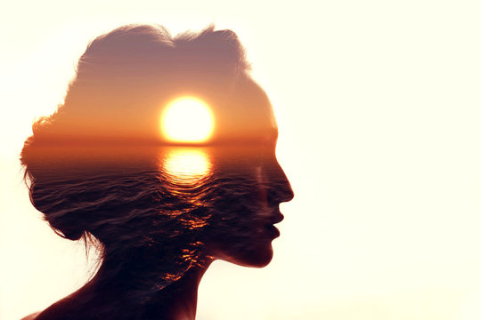 Psychology concept. Sunrise and woman silhouette.