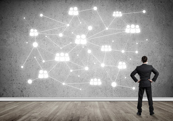 Obraz premium Connection lines drawn on concrete wall as symbol for networking