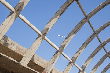 Vault in an abandoned building. An airplane in the sky.