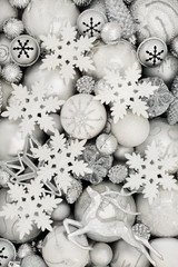 Christmas background with white and silver baubles with star, snowflake, reindeer, snowflake, balls...