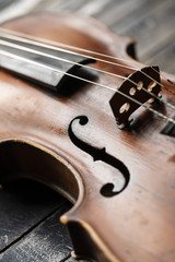 Fototapeta premium A part of a violin or a viola on a wood background