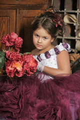 Vintage portrait of little girl in purple dress