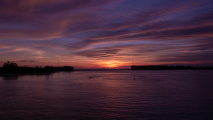 Sea and boat with sunset at evening.
