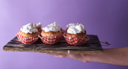Pink cupcake decorated on a blurred background