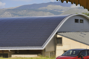solar roof of a large curved surface on a municipal building - Powered by Adobe