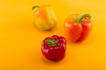 Sweet bell pepper on a colored background. Studio light. Top view