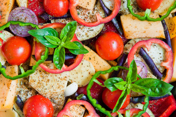 Fresh organic vegetables cut with rings prepared for baking in the oven