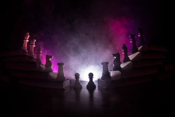 Business hierarchy. Strategy concept with chess pieces. Chess standing on a pyramid of wooden...