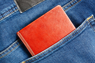 Notebook in blue jeans back pocket