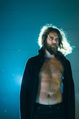 Natural man in black clothes with naked chest