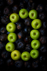 letters of the alphabet lined with green apples