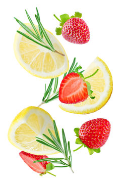 Flying Lemon slices with strawberry slices and rosemary leaves