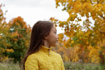 little girl model posing in autumn forest, child playing in Park