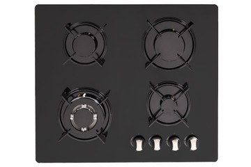 Burners on a black glass gas cooker in the kitchen
