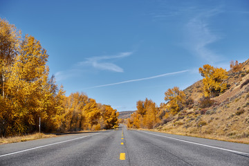 Highway at autumn in Colorado, USA.