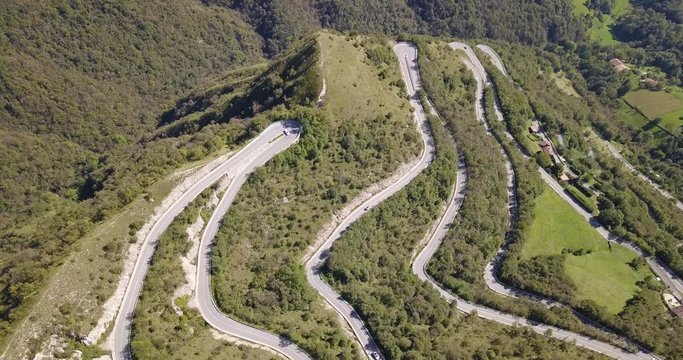 Drone aerial view of the mountain road in Italy from the village of Nembro to Selvino. Amazing aerial view of the mountain bends creating beautiful shapes
