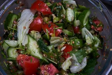 Fresh vegetable salad with tomatoes, cucumber, onion, close-up. Vegetarian healthy fitness salad food gluten free