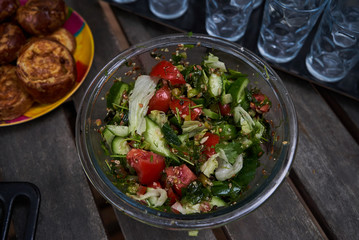 Fresh vegetable salad with tomatoes, cucumber, onion, close-up. Vegetarian healthy fitness salad food gluten free