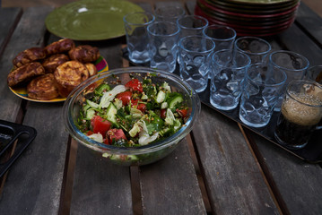 Fresh vegetable salad with tomatoes, cucumber, onion, close-up. Vegetarian healthy fitness salad food gluten free