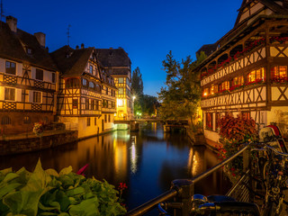 Naklejka premium Sunset along the Ill River in Petite France areas of Strasbourg in the Alsace region of France. 