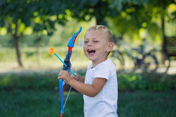 A little boy and a toy bow