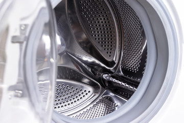 Washing machine drum close up, laundry concept