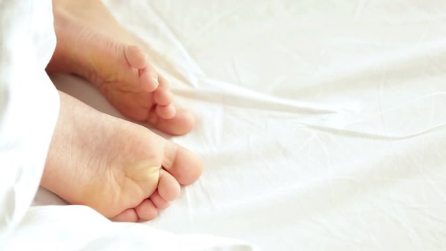 A footage of young boy's feet sleeping
