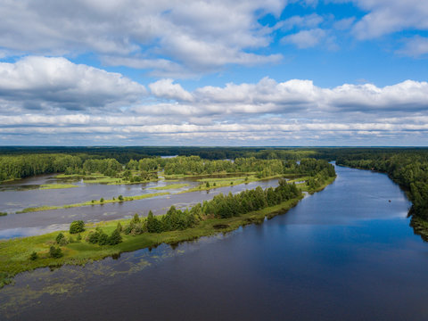 Aerial view of river Nemda with green riverside and islands. Summer 2018, Russia