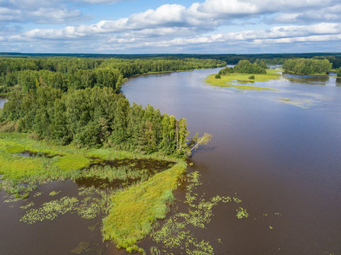 Aerial view of river Nemda with green riverside and islands. Summer 2018, Russia