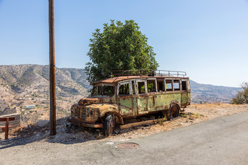 rusty bus at last stop in the mountains