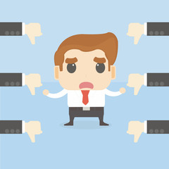 businessman getting thumbs down