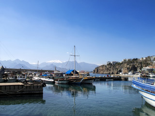 Fototapeta na wymiar Boats in Antalya harbor over clear sky