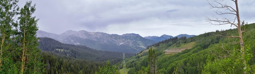 Fototapeta na wymiar Guardsman Pass views of Panoramic Landscape of the Pass, Midway and Heber Valley along the Wasatch Front Rocky Mountains, Summer Forests, Clouds and Rainstorm. Utah, United States.