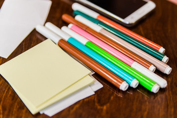 Colorfully Office and art stationery objects on wooden table