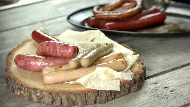 Assorted grilled sausages, pita bread. Food close up.