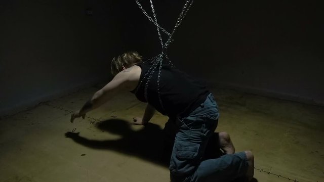 Captive bound in chains