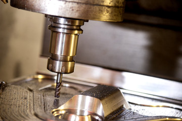 The CNC milling machine cutting the forging mold part by solid radius end mill tool.Mold manufacturing process. © Pixel_B