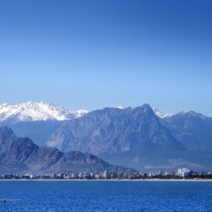 Fototapeta na wymiar Antalya city with high mountains over clear blue sky.