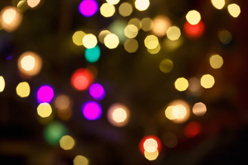 Abstract light celebration background with defocused golden lights for Christmas, New Year, Holiday, party