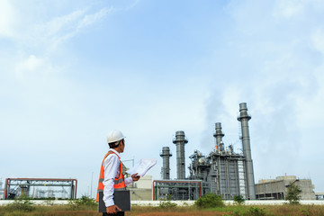 Engineer is checking plant around Gas turbine electrical power plant
