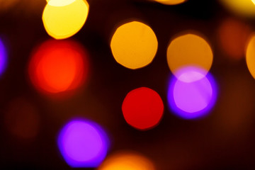 Abstract light celebration background with defocused golden lights for Christmas, New Year, Holiday, party