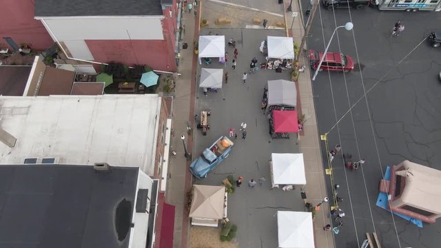 BRIDGEWATER, PA - Circa October, 2018 - An aerial bird's eye view establishing shot of the Bridgewater Fall Street Festival. Pittsburgh suburbs.	 	