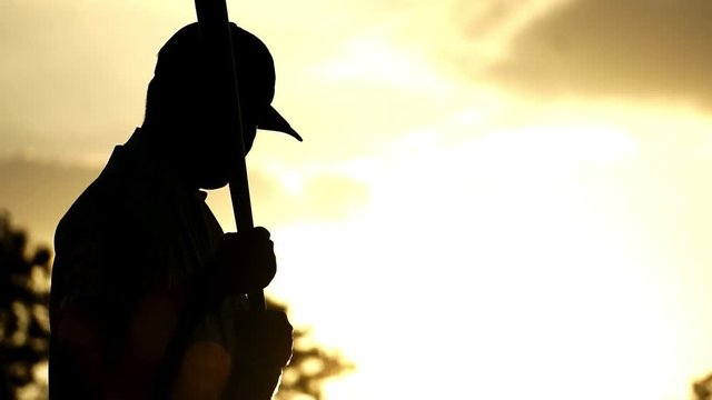 Men's baseball practice hitting a baseball with the light of sunset footage slow motion