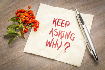 Keep asking why? Inspirational handwriting on a napkin