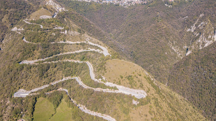 Drone aerial view of the mountain road in Italy from the village of Nembro to Selvino. Amazing...